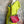 Load image into Gallery viewer, Alma shoulder bag in red pebbled leather with gray handles and teal accents on lime green dress mannequin - 1
