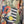 Load image into Gallery viewer, D541 waffle knit cowlneck dress featuring vibrant abstract fruit and geometric mixed print, draped on mannequin - 19
