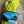 Load image into Gallery viewer, Mila color-block crossbody bag in teal, blue, and navy leather with turquoise strap, styled on mannequin with lime dress - 10
