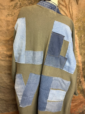 Olive green ribbed cotton cardigan with denim patchwork LOVE letters on back, displayed on mannequin - 4