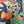 Load image into Gallery viewer, D541 waffle knit cowlneck dress featuring vibrant abstract fruit and geometric mixed print, draped on mannequin - 32
