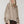 Load image into Gallery viewer, Woman wearing oversized taupe quarter-zip pullover sweatshirt with exposed seams and ribbed cuffs - 1
