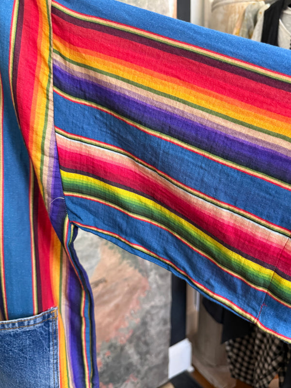 Boho serape striped duster cardigan with denim pockets, styled with red bead necklace and belt on mannequin - 11