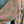 Load image into Gallery viewer, Woman wearing DYM90081 Bloomspell Maxi Dress in orange floral print with pink Converse sneakers in boutique setting - 6
