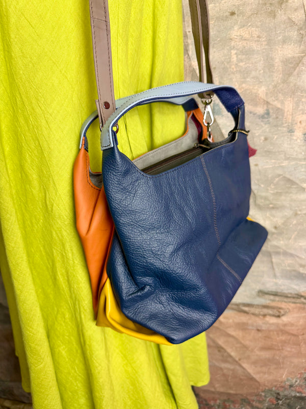 Soruka orange multicolor leather crossbody bag with gray strap on lime green linen dress mannequin - 4