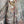 Load image into Gallery viewer, Boho waffle knit tunic top with abstract art print in earthy tones, styled with colorful chain necklace on mannequin - 14
