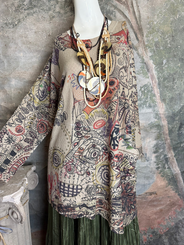 Boho waffle knit tunic top with abstract art print in earthy tones, styled with colorful chain necklace on mannequin - 14