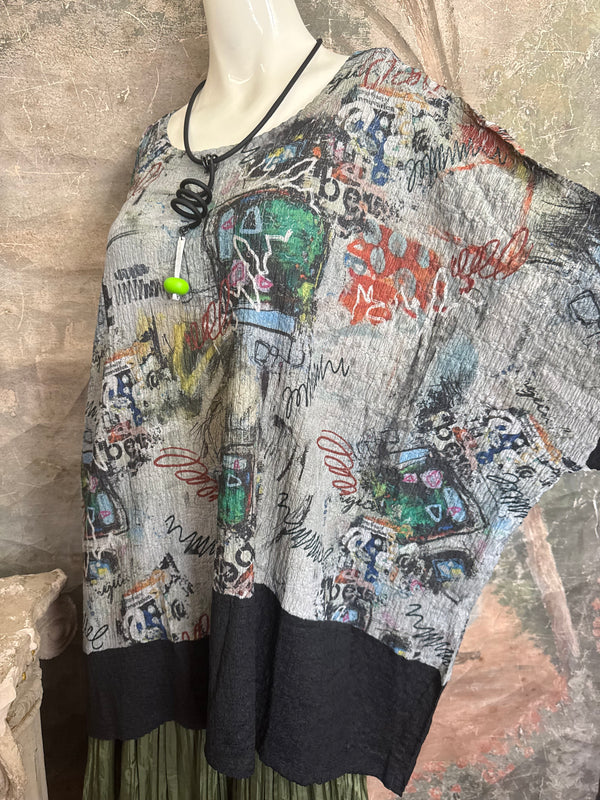 T1597 Waffle Knit Pullover with graffiti print over olive green crinkle tiered skirt on mannequin - 6