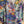 Load image into Gallery viewer, Oversized crew pullover in vibrant multicolor abstract print with flower necklace, paired with black pants on mannequin - 5
