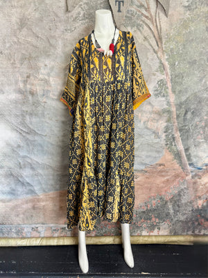 Black and yellow floral kantha quilted tiered maxi dress with wide sleeves on mannequin, bohemian style - 1