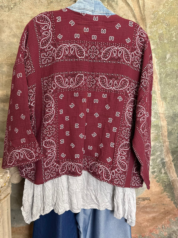 Burgundy bandana print short kimono with denim pocket accents, layered over white top and blue denim skirt with bead nec - 11