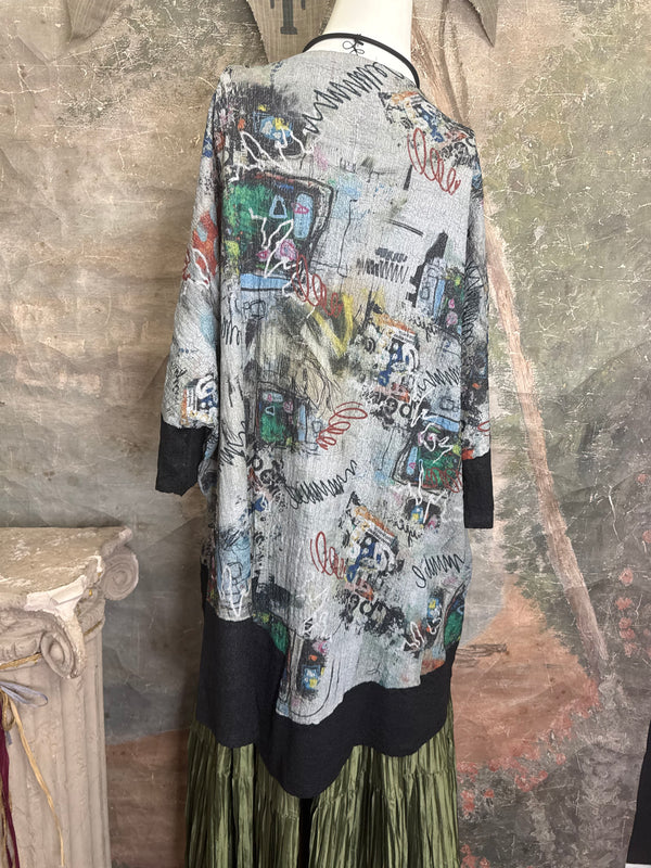 T1597 Waffle Knit Pullover with graffiti print over olive green crinkle tiered skirt on mannequin - 9