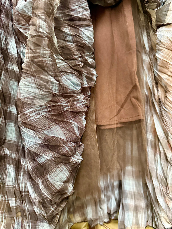 Flowy plaid midi skirt in blue-gray tones styled with patched denim jacket and pearl necklace on boutique display - 8