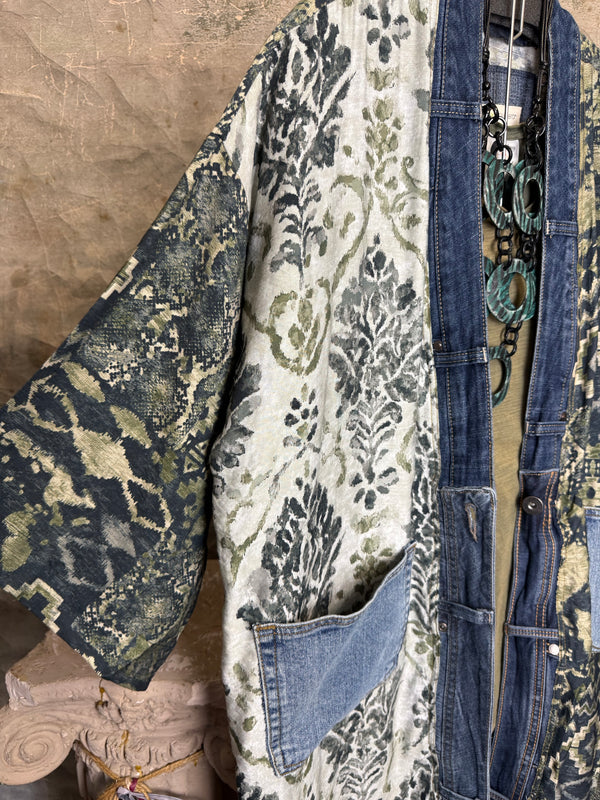 Boho patchwork denim cardigan with floral and aztec prints, large patch pockets, open front, styled with green necklace - 3