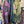 Load image into Gallery viewer, Sequin R&amp;L patch bomber jacket in purple and yellow-green ombre with floral accents, styled with tiered maxi skirt - 6
