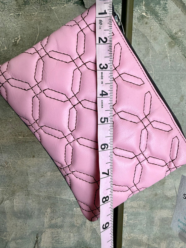 Pink leather quilted crossbody bag with geometric stitching pattern and black adjustable strap on lime green dress - 3