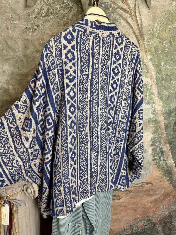 Blue white shibori ikat print kimono jacket open front boho style layered over floral tee with flower necklace - 8