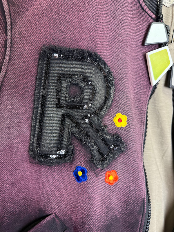 Sequin R&L patch bomber jacket in purple and yellow-green ombre with floral accents, styled with tiered maxi skirt - 12