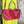 Load image into Gallery viewer, Alma shoulder bag in red pebbled leather with gray handles and teal accents on lime green dress mannequin - 4
