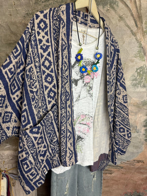Blue white shibori ikat print kimono jacket open front boho style layered over floral tee with flower necklace - 2