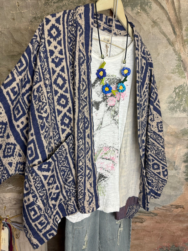 Blue white shibori ikat print kimono jacket open front boho style layered over floral tee with flower necklace - 2