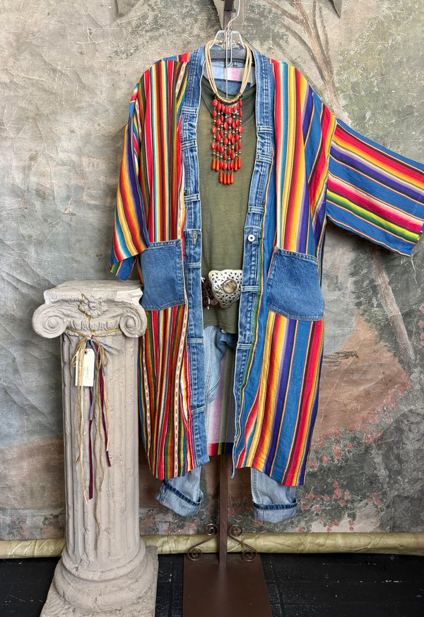 Boho serape striped duster cardigan with denim pockets, styled with red bead necklace and belt on mannequin - 16