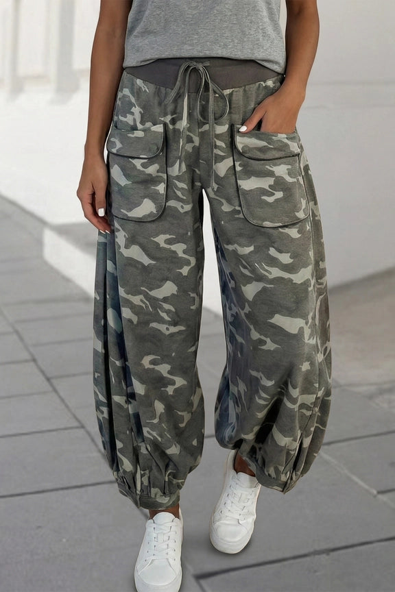 Woman wearing gray camouflage cargo jogger pants with patch pockets and white crop top, casual street style outfit - 7