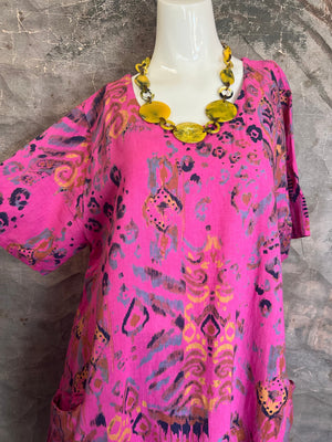 Fuchsia pink short sleeve linen blend dress with multicolor ikat paint splotch print and side pockets on mannequin - 4
