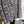 Load image into Gallery viewer, Blue white shibori ikat print kimono jacket open front boho style layered over floral tee with flower necklace - 7
