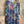 Load image into Gallery viewer, Oversized crew pullover in vibrant multicolor abstract print with flower necklace, paired with black pants on mannequin - 8
