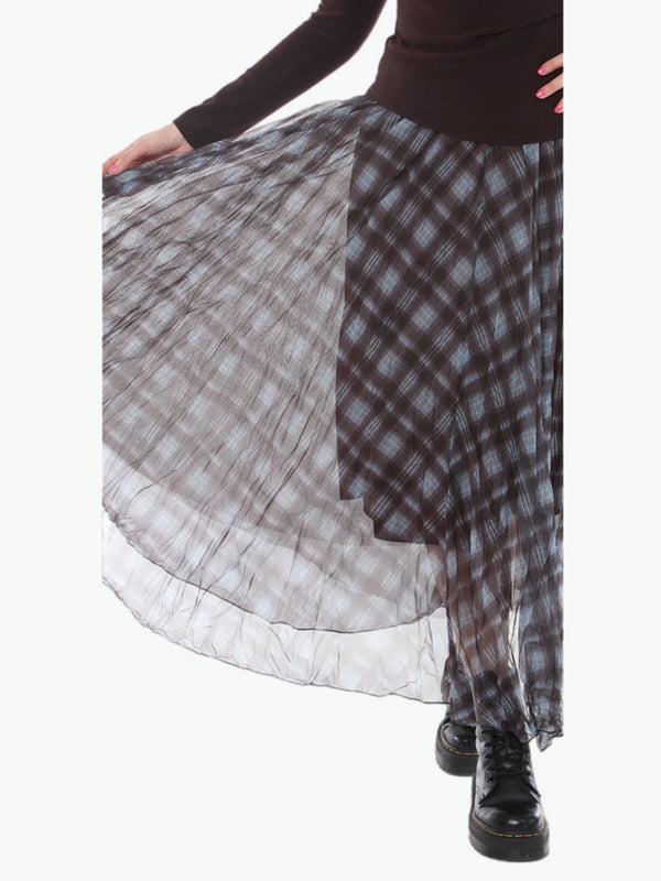 Flowy plaid midi skirt in blue-gray tones styled with patched denim jacket and pearl necklace on boutique display - 3