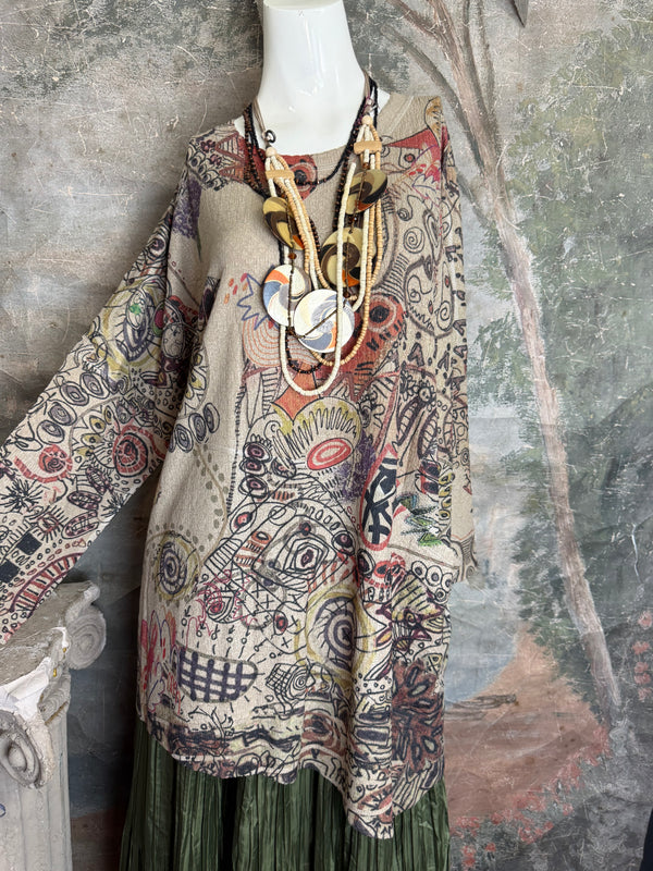 Boho waffle knit tunic top with abstract art print in earthy tones, styled with colorful chain necklace on mannequin - 13