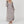 Load image into Gallery viewer, Woman wearing taupe long sleeve V-neck maxi dress with pockets and side slit, styled with platform sandals - 3
