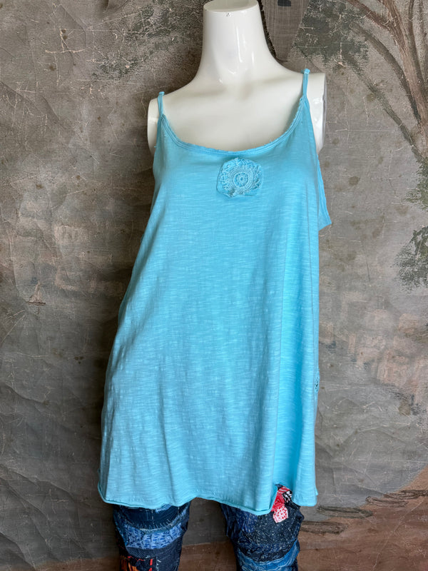Light blue spaghetti strap cami tank top with lace rosette detail, flowy A-line silhouette on mannequin - 1