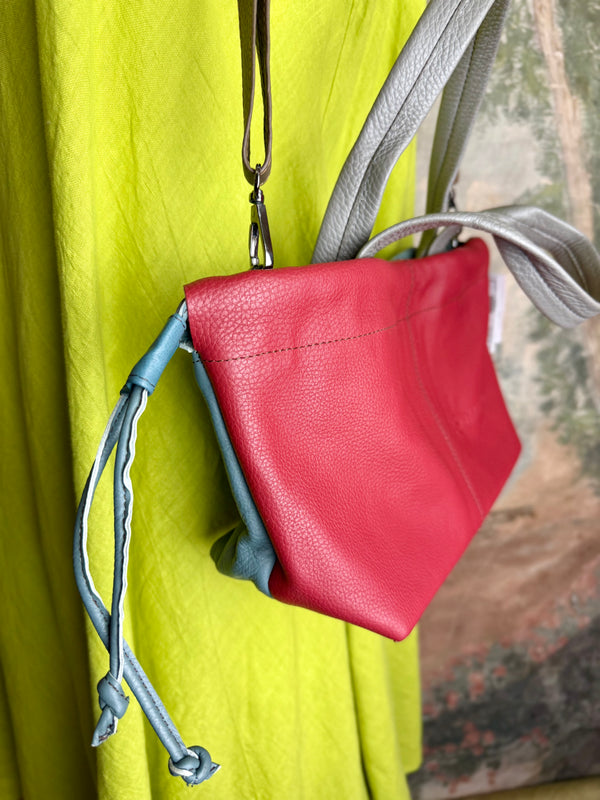 Alma shoulder bag in red pebbled leather with gray handles and teal accents on lime green dress mannequin - 3