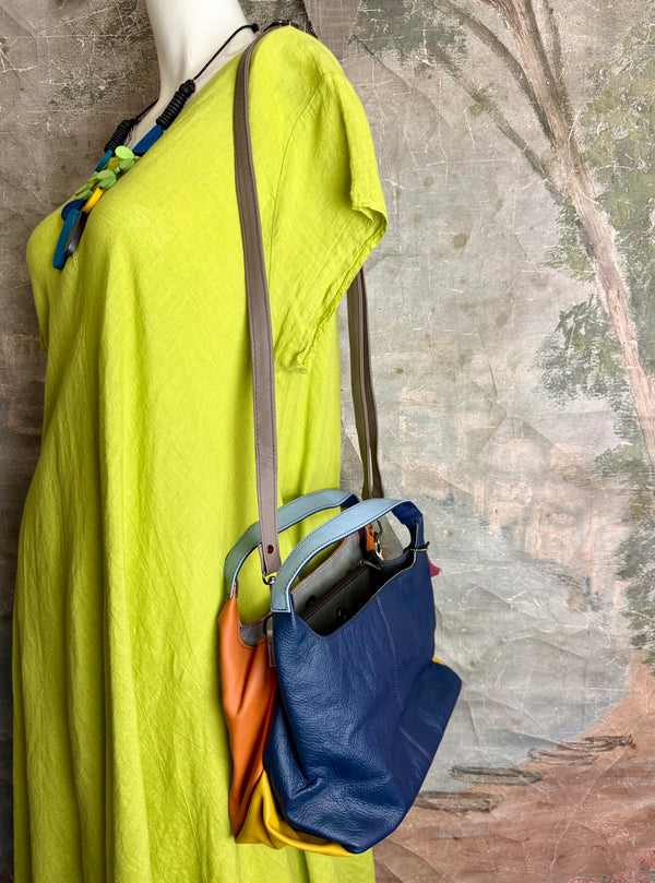Soruka orange multicolor leather crossbody bag with gray strap on lime green linen dress mannequin - 13