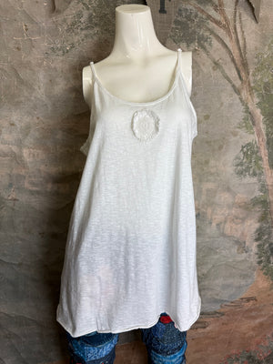 White flowy spaghetti strap cami tank top with raw lace rosette detail, paired with patchwork denim leggings - 1
