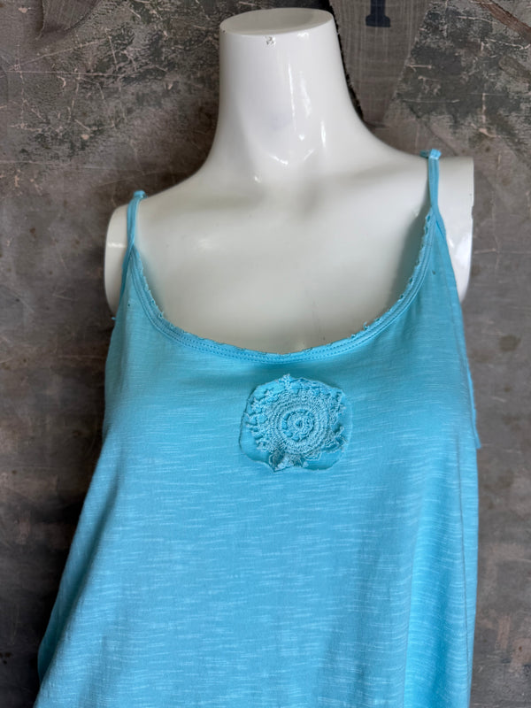 Light blue spaghetti strap cami tank top with lace rosette detail, flowy A-line silhouette on mannequin - 2