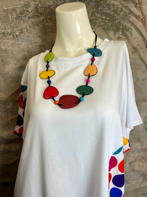 White oversized dress with rainbow polka dot panels and colorful statement necklace on mannequin, 3539 Rainbow Dots Mult - 11