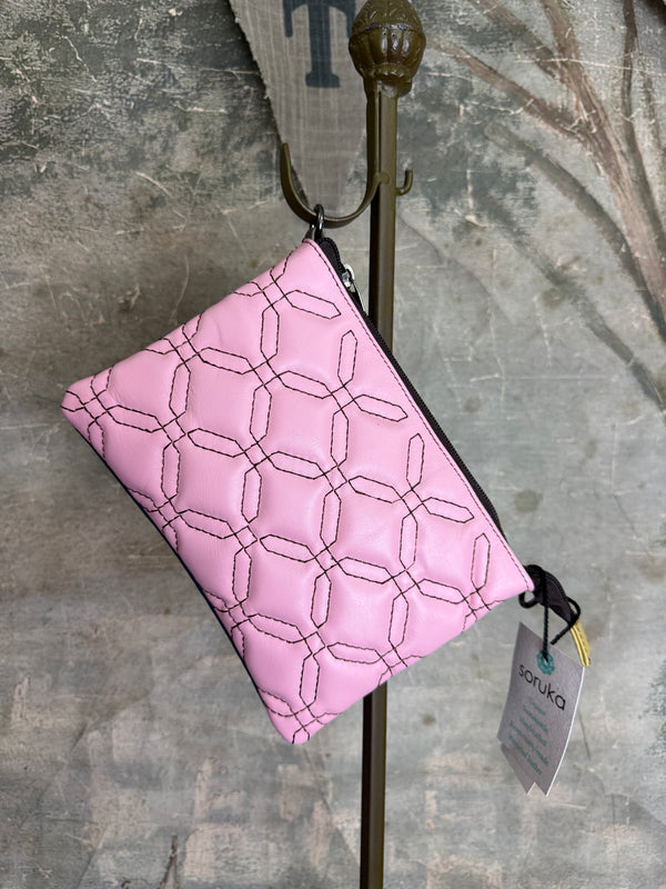Pink leather quilted crossbody bag with geometric stitching pattern and black adjustable strap on lime green dress - 7