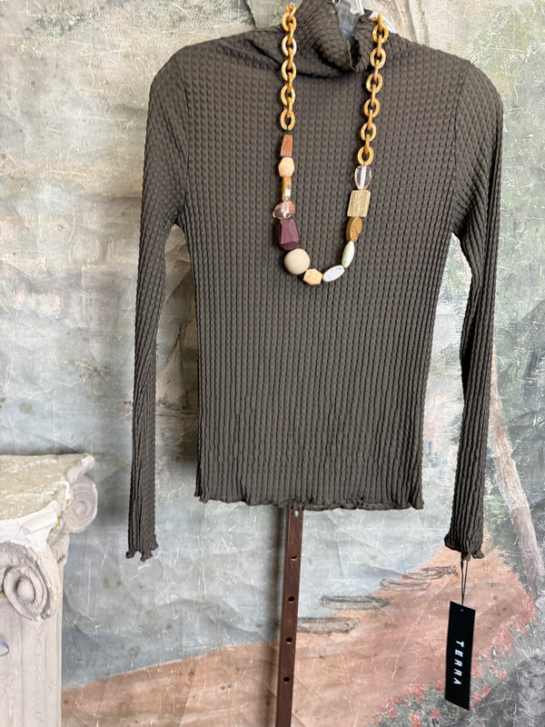 Olive green waffle knit turtleneck long sleeve fitted top displayed with chunky beaded statement necklace on hanger - 3