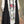 Load image into Gallery viewer, Long black sleeveless open front duster vest styled with graphic tee, gingham pants, and black beaded necklace on hanger - 3
