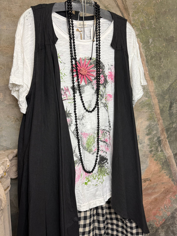 Long black sleeveless open front duster vest styled with graphic tee, gingham pants, and black beaded necklace on hanger - 3