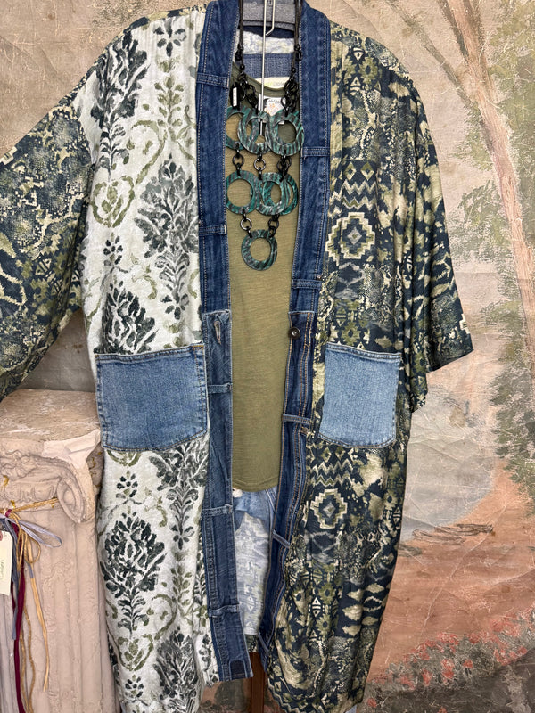 Boho patchwork denim cardigan with floral and aztec prints, large patch pockets, open front, styled with green necklace - 6