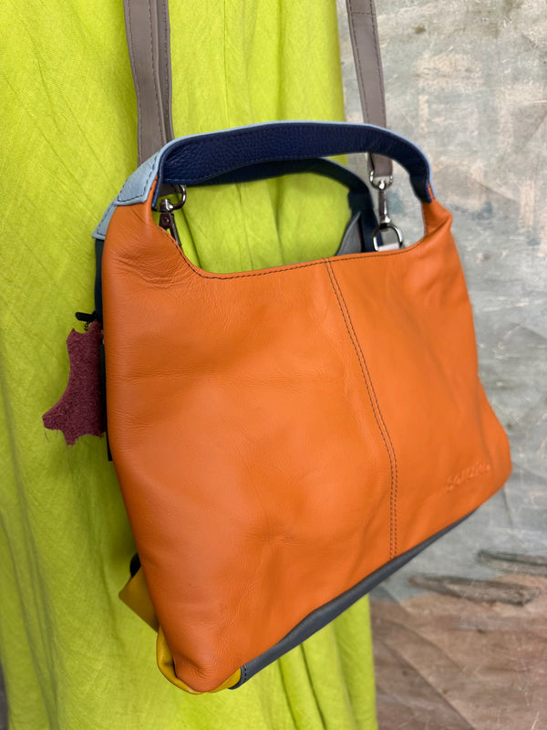 Soruka orange multicolor leather crossbody bag with gray strap on lime green linen dress mannequin - 7