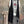 Load image into Gallery viewer, Long black sleeveless open front duster vest styled with graphic tee, gingham pants, and black beaded necklace on hanger - 9
