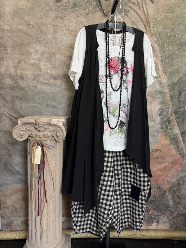 Long black sleeveless open front duster vest styled with graphic tee, gingham pants, and black beaded necklace on hanger - 9
