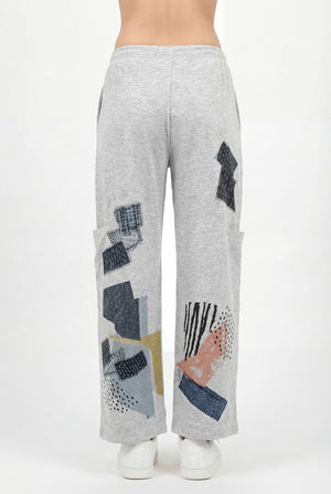 Grey loose pocket pants with abstract geometric print design, wide leg casual style, elastic waist, white sneakers - 2