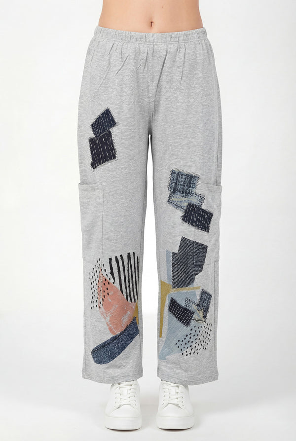 Grey loose pocket pants with abstract geometric print design, wide leg casual style, elastic waist, white sneakers - 1