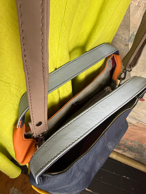 Soruka orange multicolor leather crossbody bag with gray strap on lime green linen dress mannequin - 11